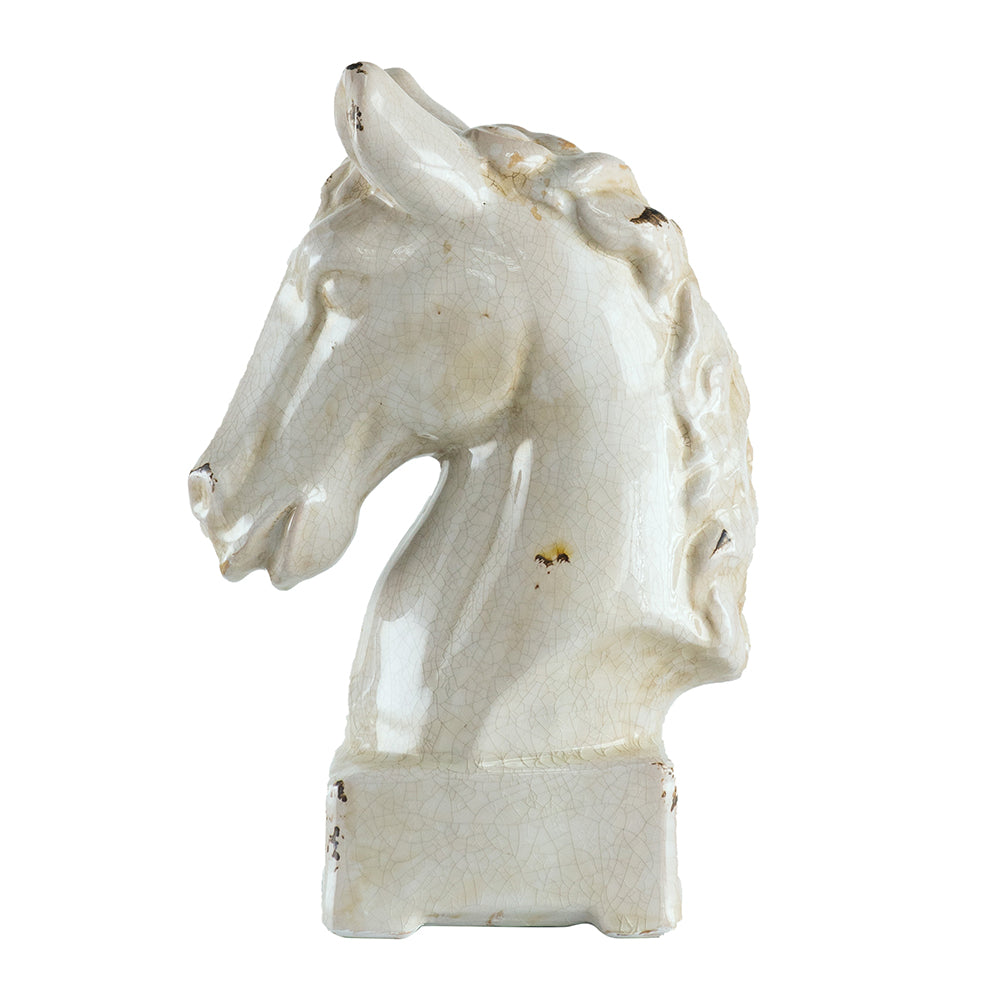 White ceramic horse head sculpture on a white background