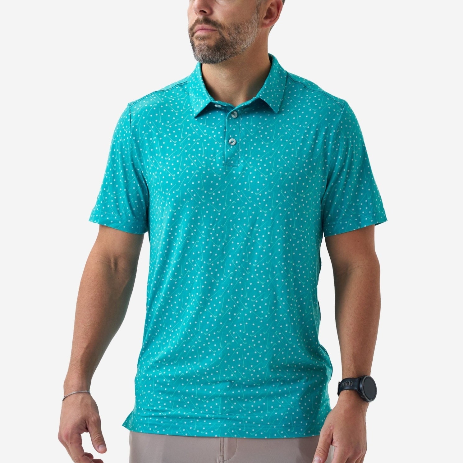 Man wearing a teal polka dot polo shirt on a white background