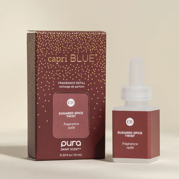 Capri Blue fragranced refill bottle and packaging on a beige background