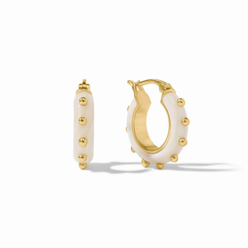 Gold hoop earrings with white beads on a white background