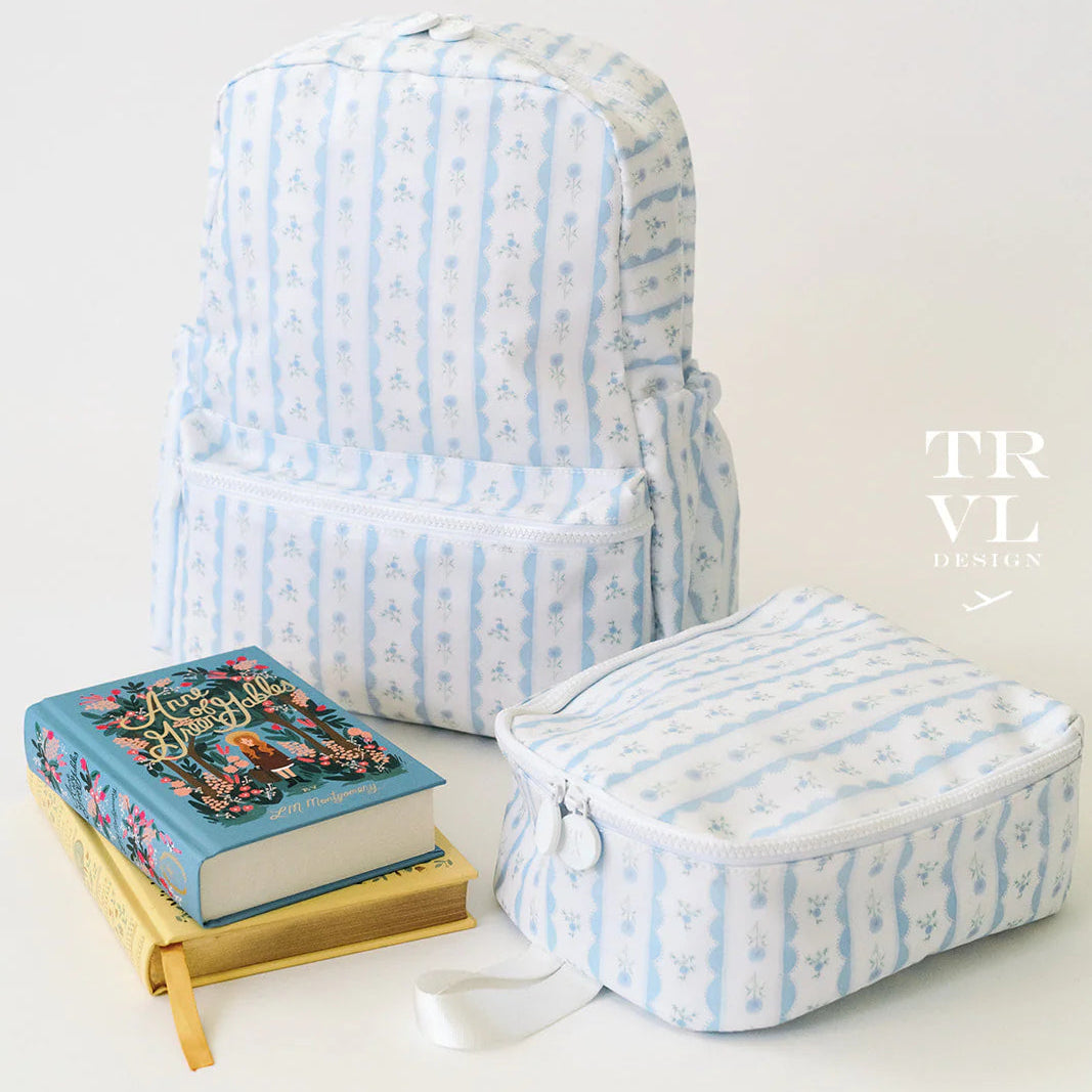 Light blue striped backpack and travel pouch on a white background with 'TRVL' branding.