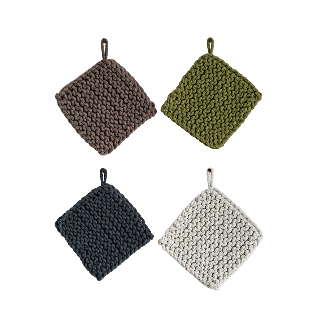 Four knitted pot holders in brown, green, black, and gray on a white background