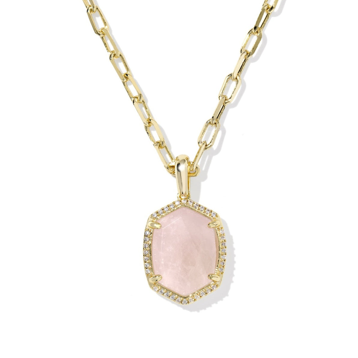 Necklace with a pink pendant and gold chain on a white background