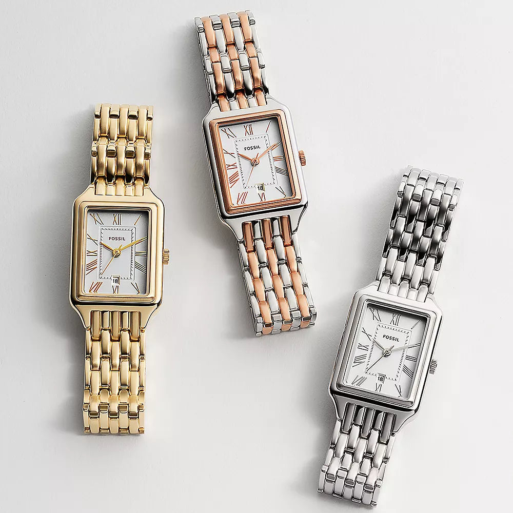 Three  Fossil watches with gold, rose gold, and silver metal bands on a light gray background.