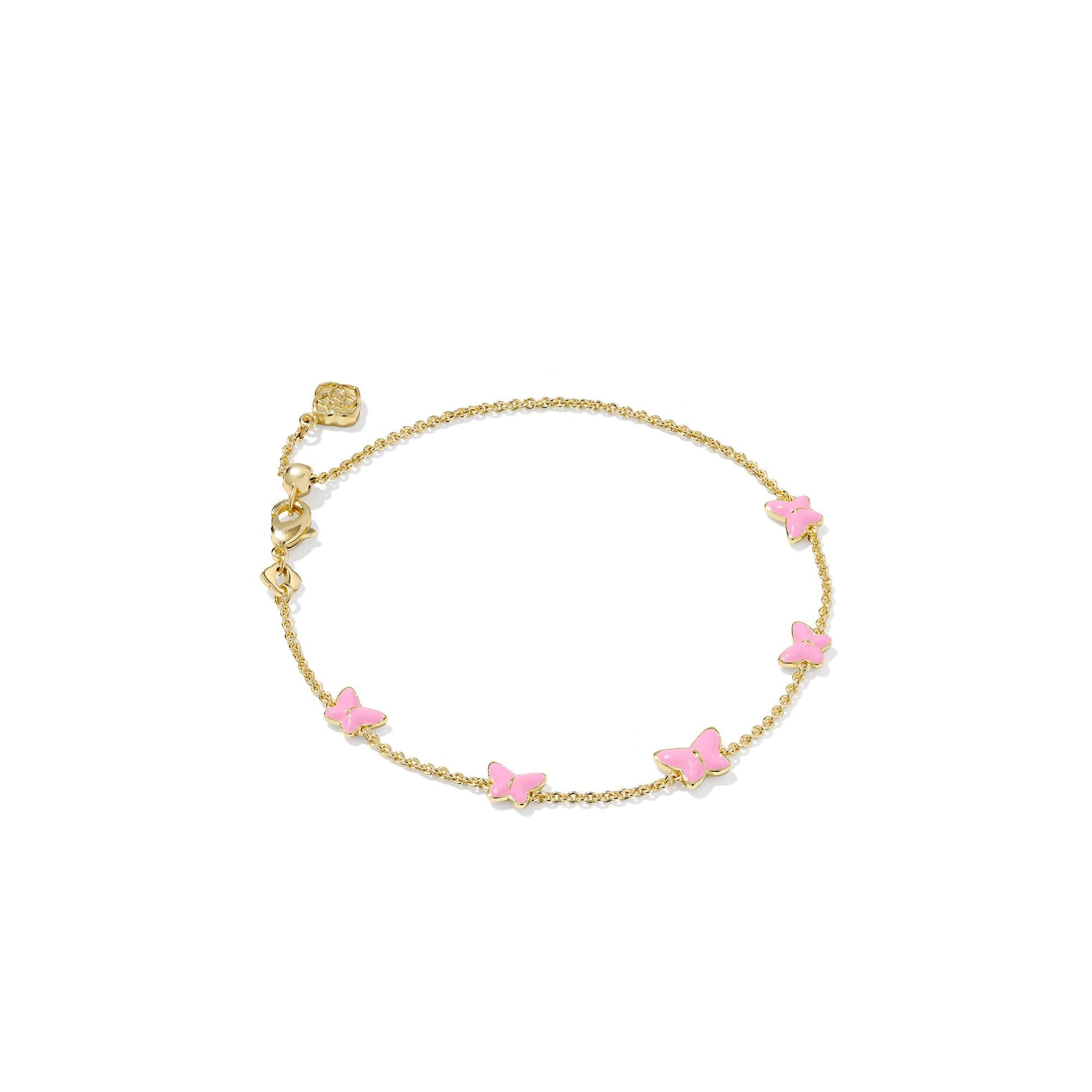 Gold bracelet with pink butterfly charms on a white background