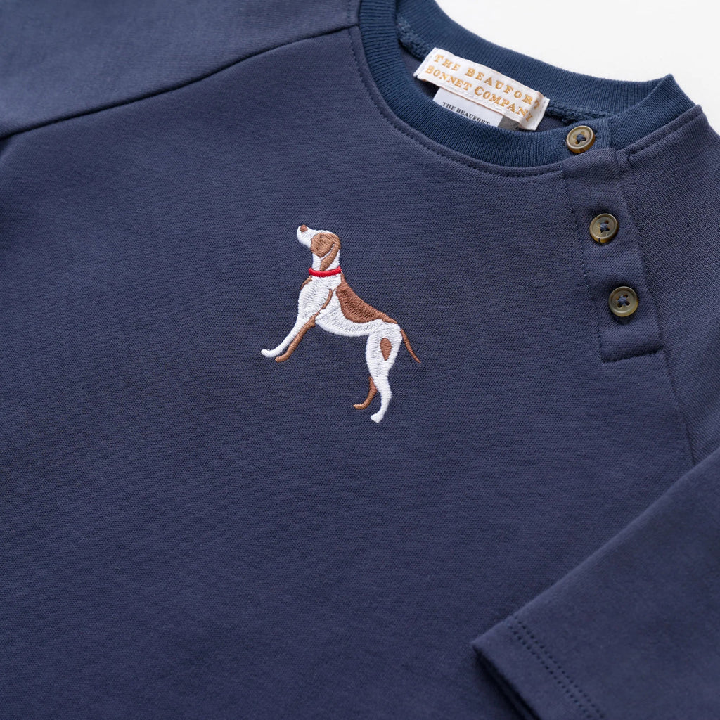 Navy blue long-sleeve shirt with embroidered dog design on a white background