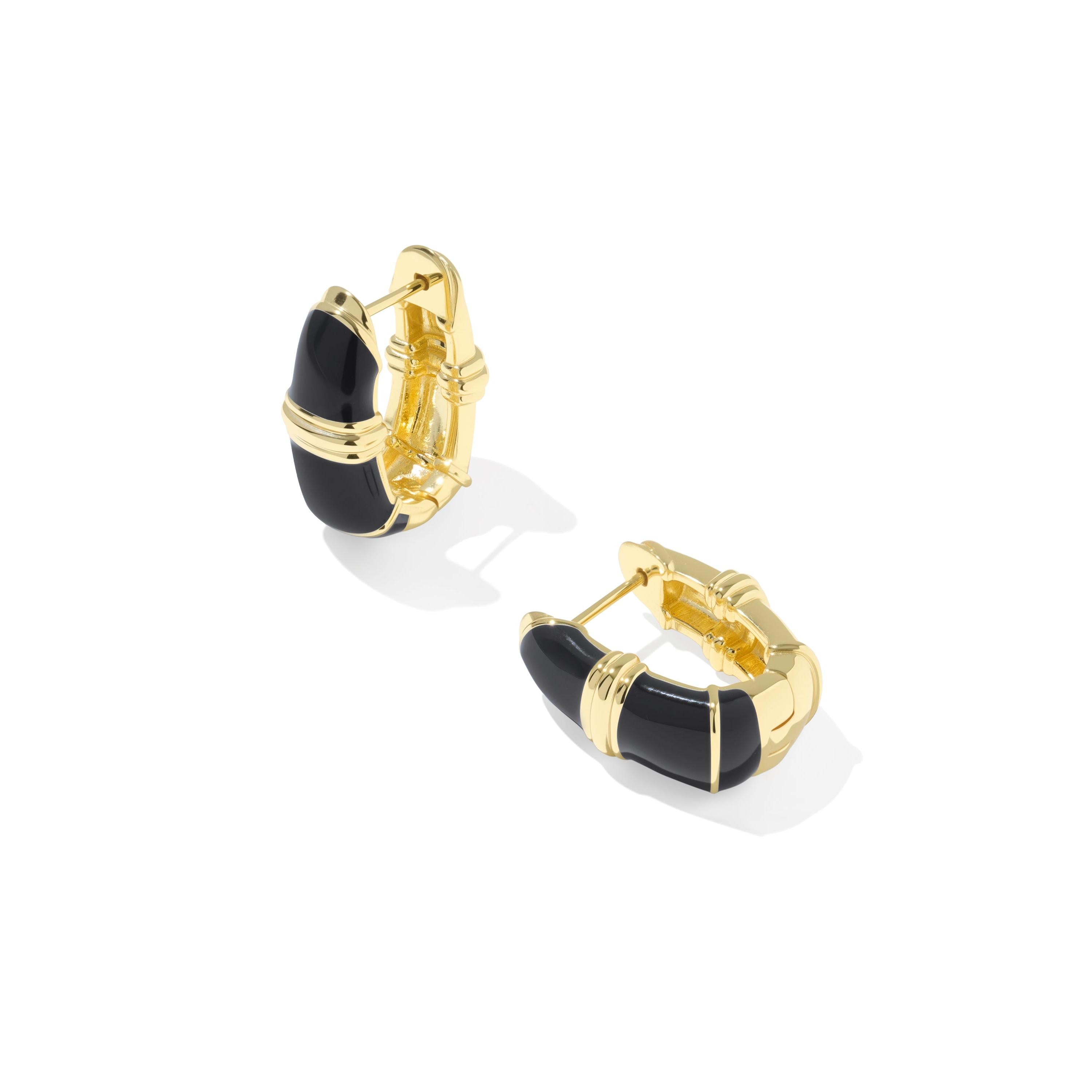 A pair of gold Kendra Scott Courtney earrings with black enamel inlay.