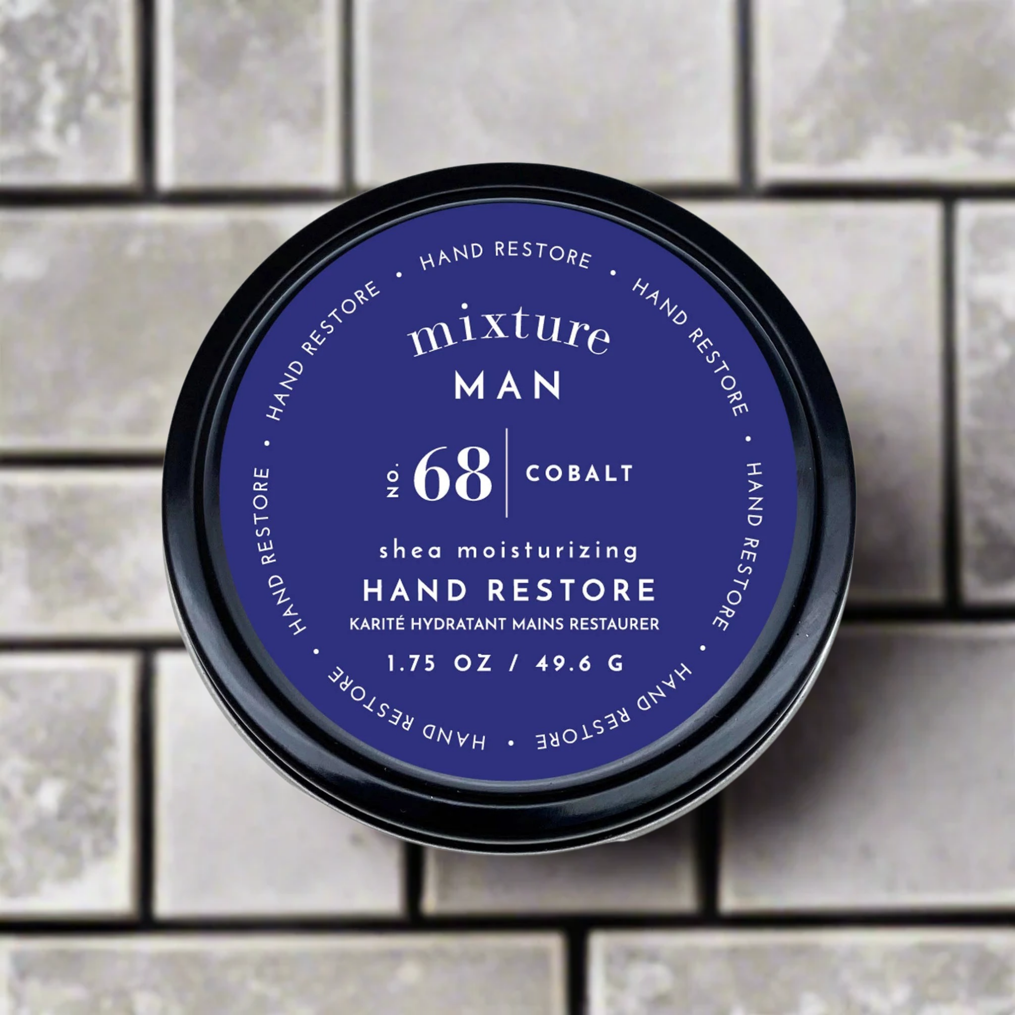 Hand restore product with blue label on a tiled background