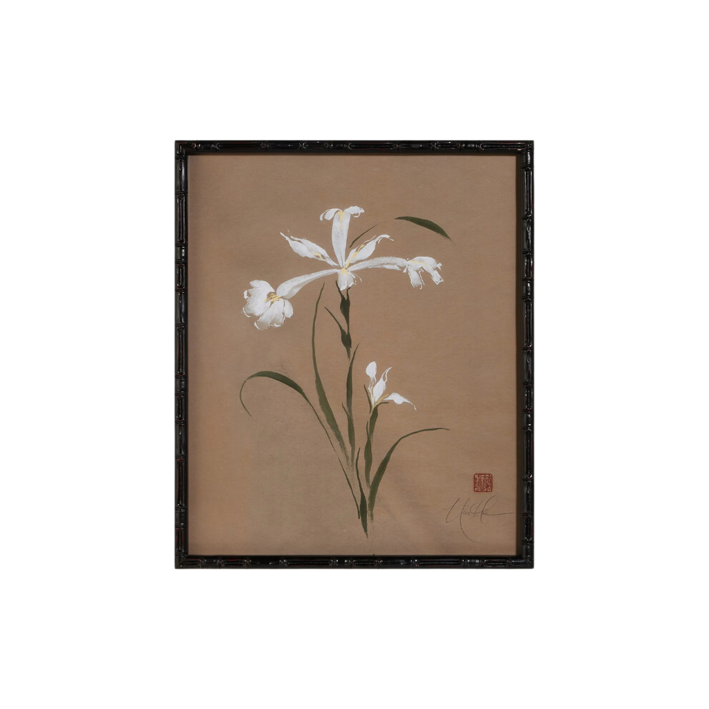 Framed artwork of a white flower on a beige background