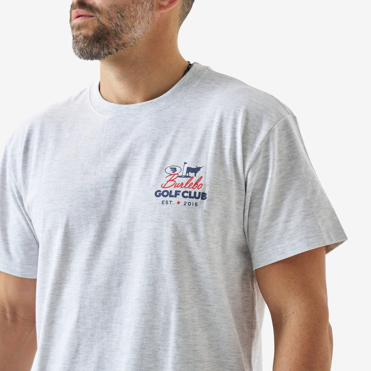 Man wearing a gray t-shirt with a logo on a white background