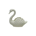 White swan-shaped planter on a white background
