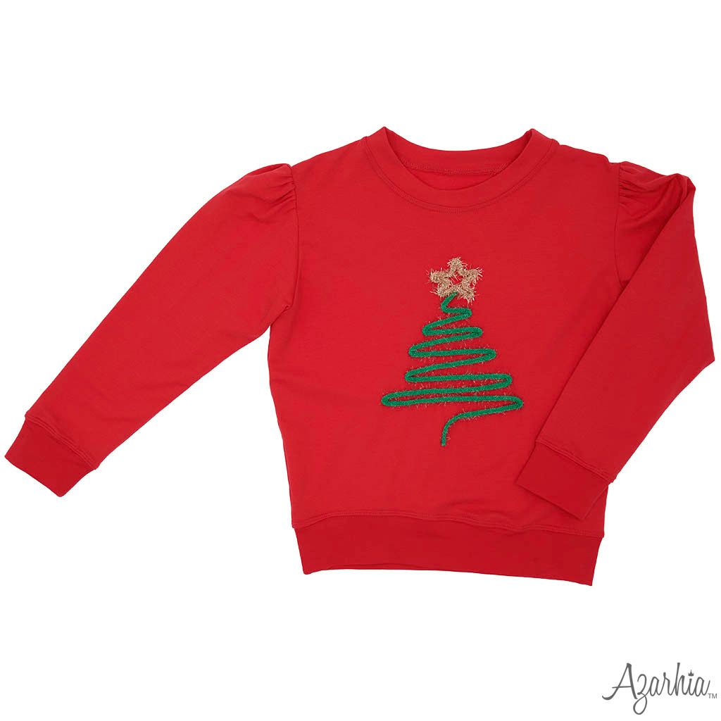 Christmas Tree in Tinsel on Red Holly