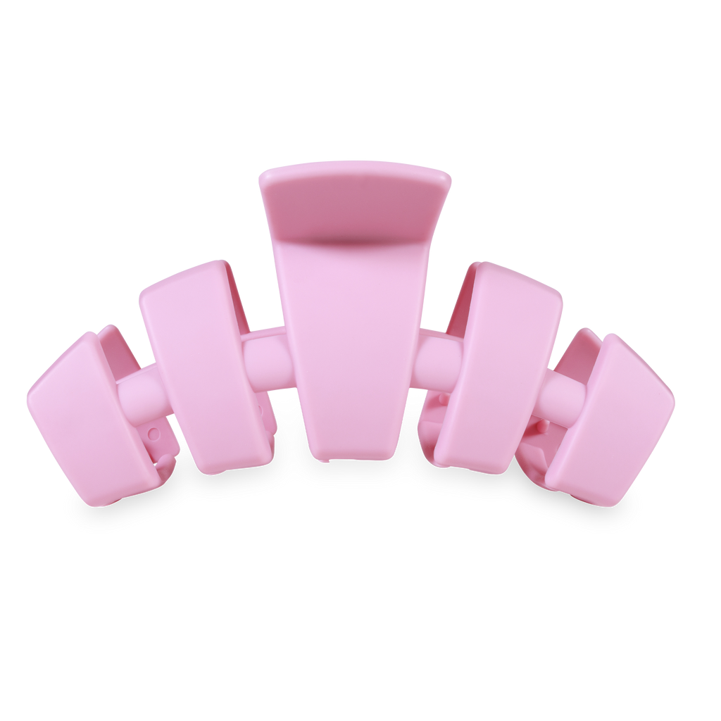 Pink hair clip on a white background