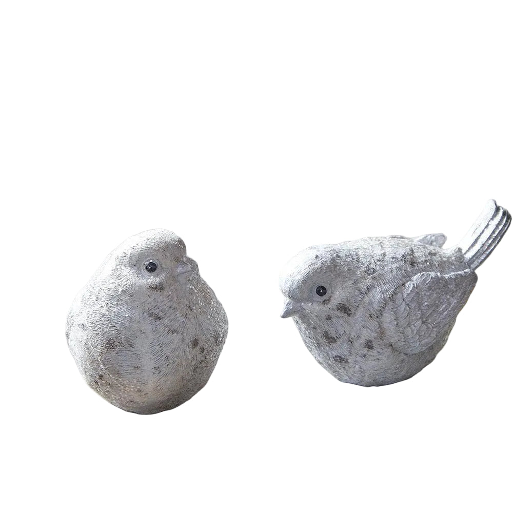 Two stone bird sculptures