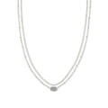 Silver necklace with a subtle design on a white background