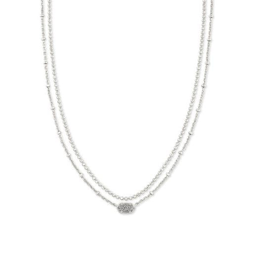 Silver necklace with a subtle design on a white background
