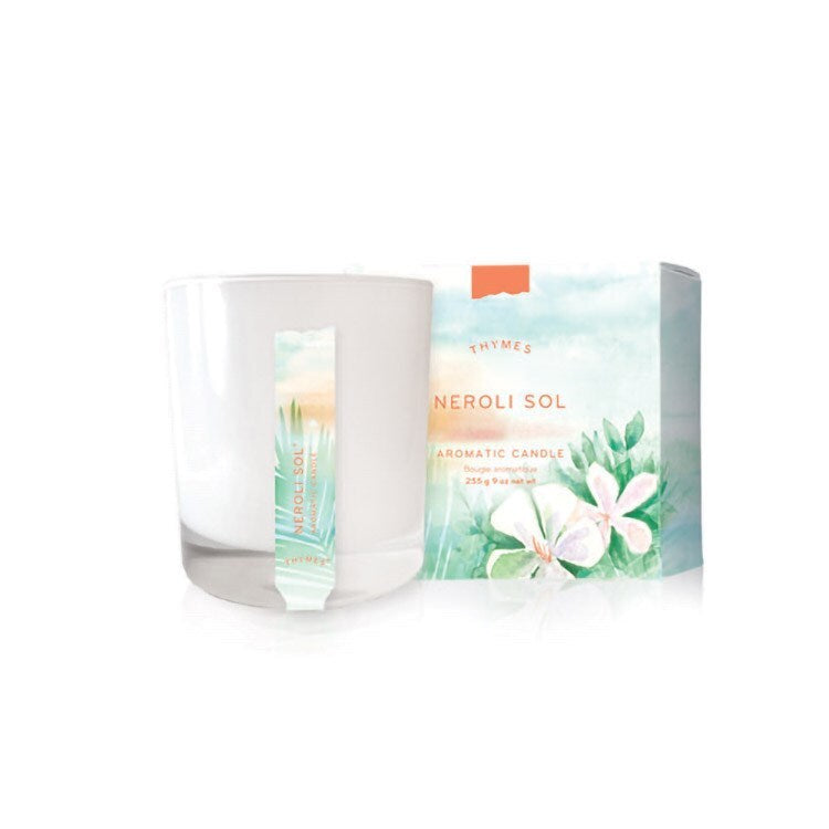 Aromantic candle with packaging featuring floral design on a white background