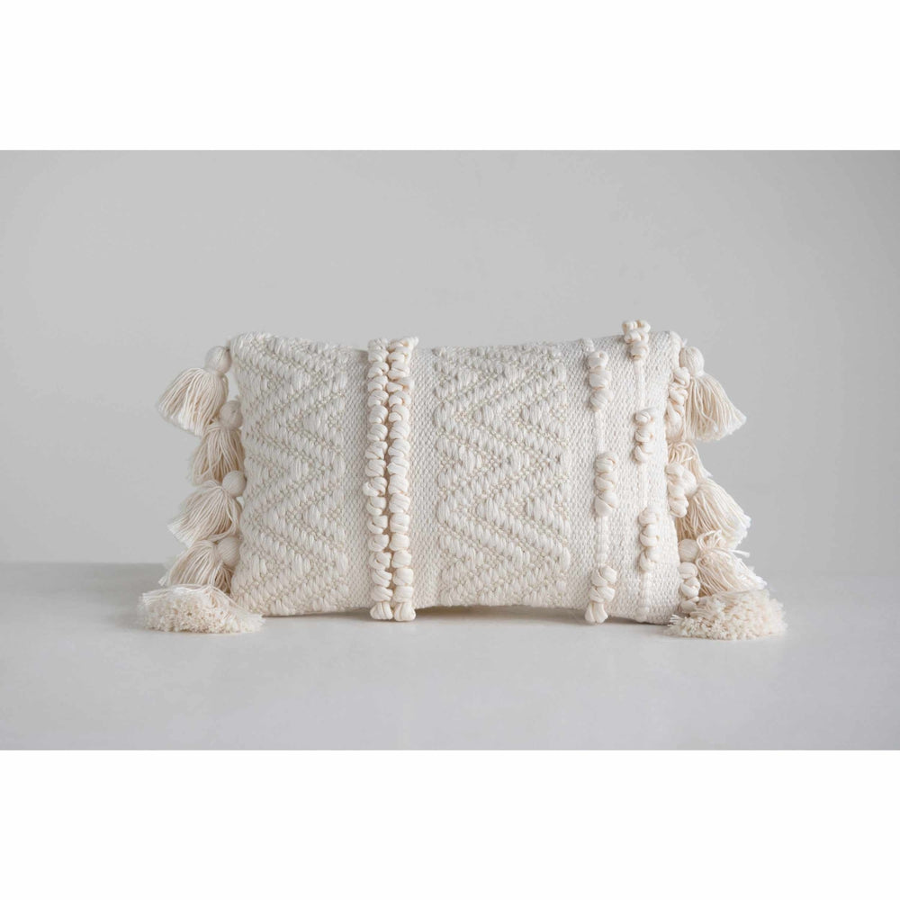 White pillow outlet with pom poms