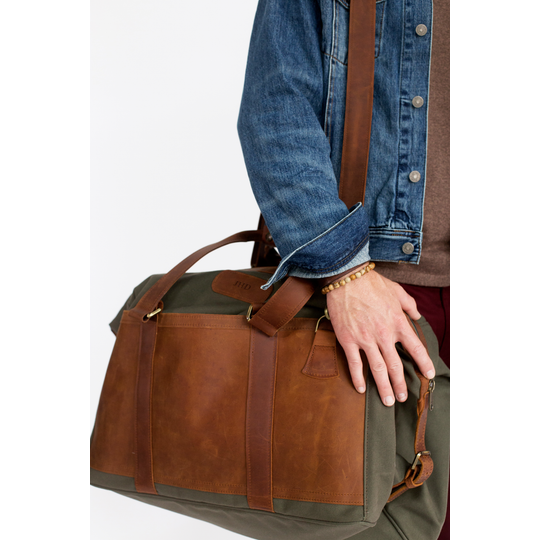 Quality made in America cotton canvas and oiled leather duffel bag with leather patch to personalize with initials or monogram